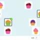 Interface de jogo de pareamento com cupcakes coloridos, corações nos cantos e um cupcake central selecionado.
