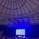 Participantes em uma conferência no Porto, com palestrantes e tela de projeção durante o Congresso Global de Neuropsicologia.