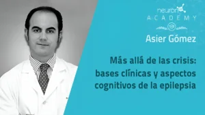 Homem de jaleco branco em ambiente educacional Neuron Academy; imagem em preto e branco com fundo azul, relacionado à epilepsia.