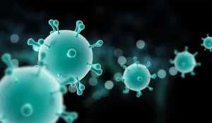 Micrographie en couleur d'un coronavirus avec des particules sphériques et des épines, sur fond sombre, utile pour la neuro-réhabilitation.