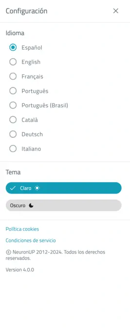 Fenêtre de configuration de NeuronUP : langue et thème, commutateur de mode sombre et liens vers les cookies et les conditions de service.