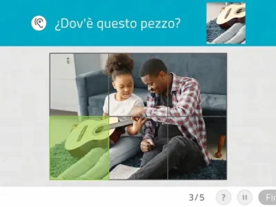 Puzzle in corso con un bambino e un adulto; pezzi incastrati, si vede una chitarra e la domanda 'Dove si trova questo pezzo?'.