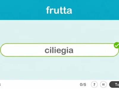 Interfaccia di NeuronUP per la categoria lampo 'frutti': titolo, campo con 'ciliegia' verificata e 0/5; pulsante Termina.